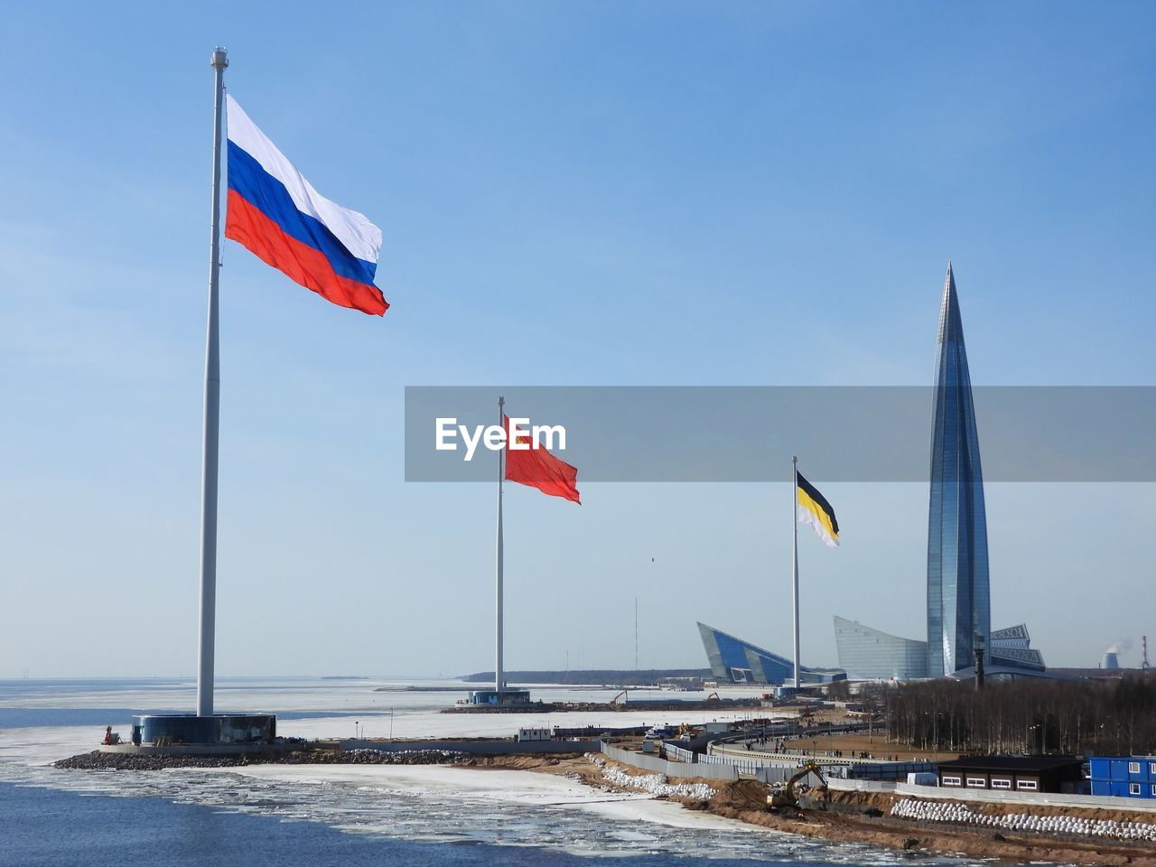 flag, patriotism, sky, nature, water, environment, sea, no people, day, wind, architecture, blue, snow, pole, travel destinations, outdoors, travel, beach, built structure, clear sky, land, sunny, scenics - nature