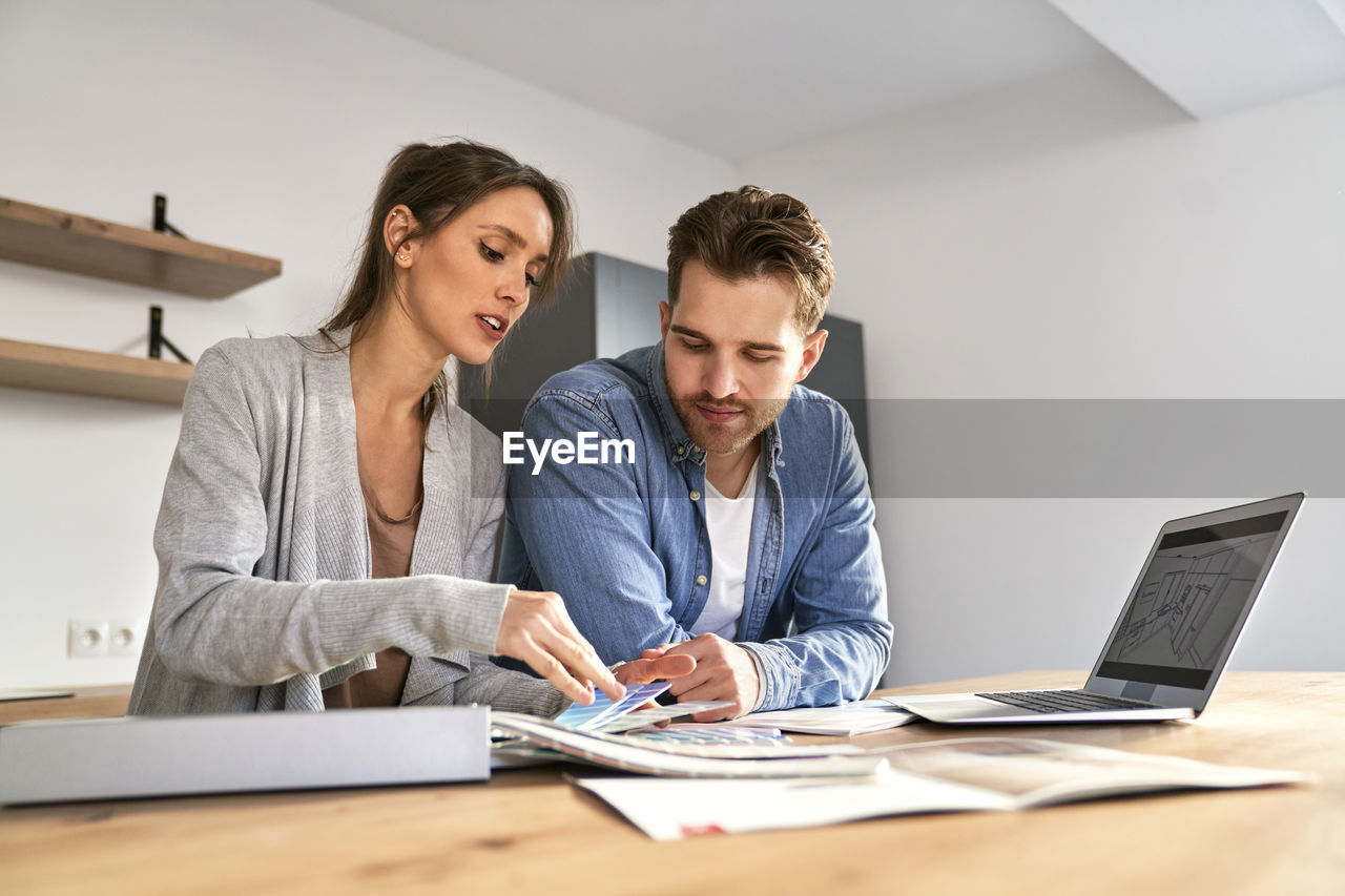 business colleagues working at desk in office