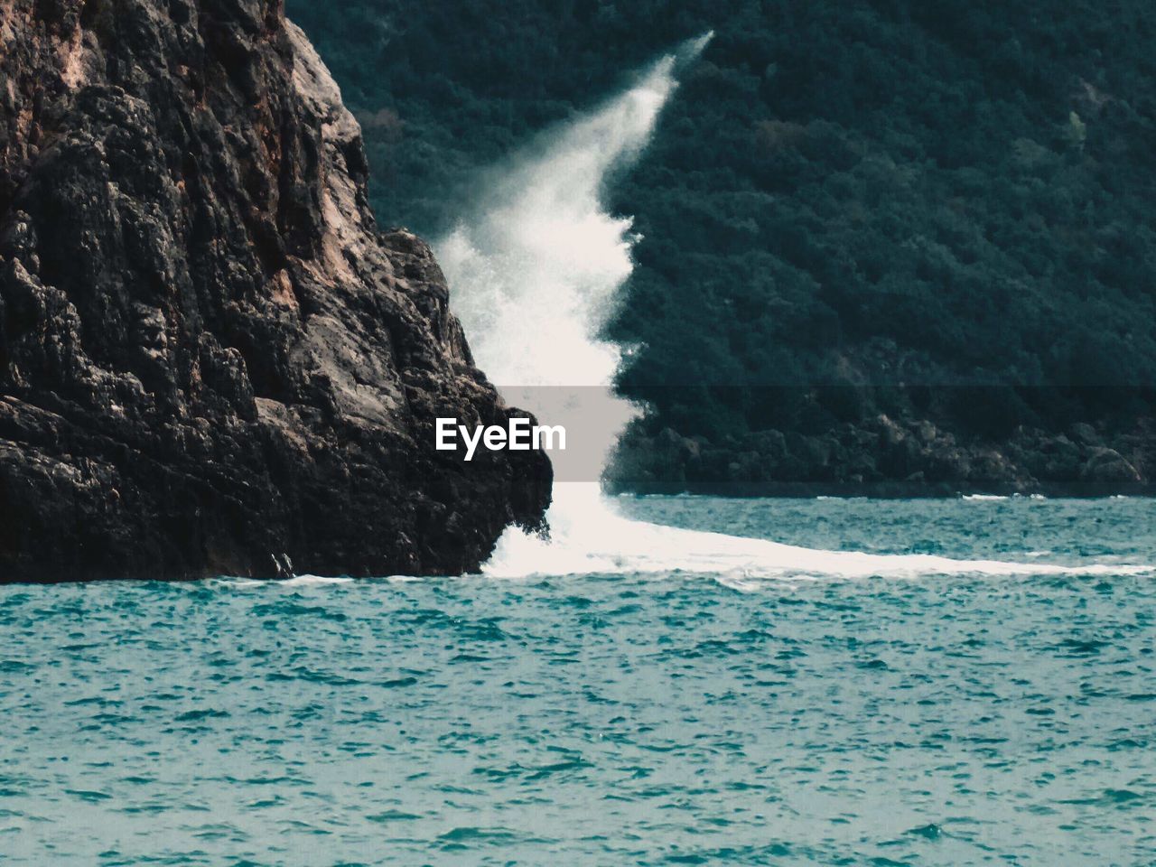 SCENIC VIEW OF SEA BY ROCKS