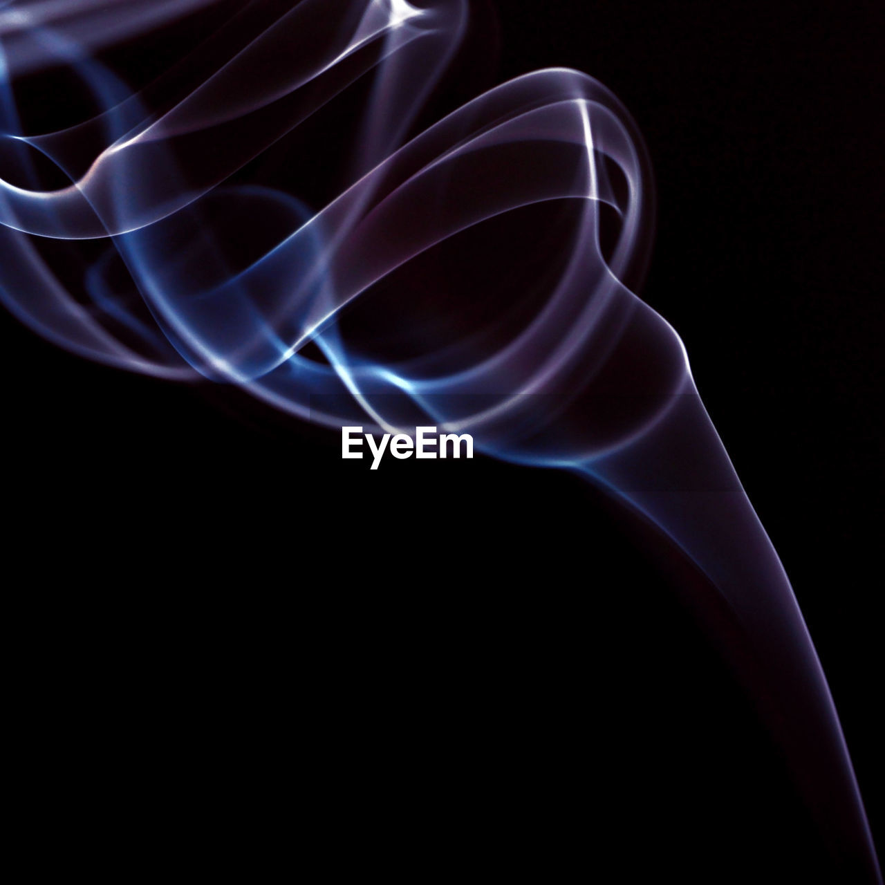 Close-up of smoke pattern on black background