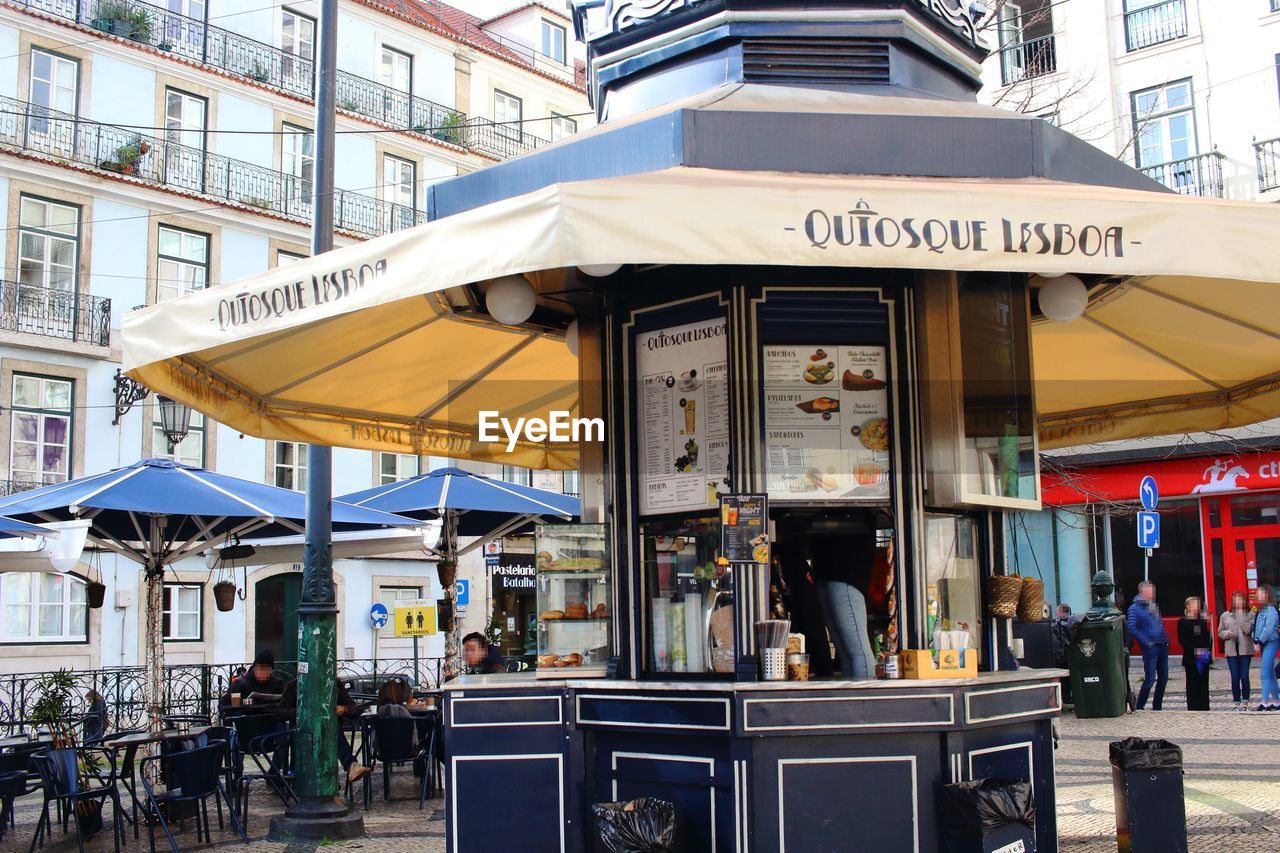 INFORMATION SIGN ON RESTAURANT BY BUILDING