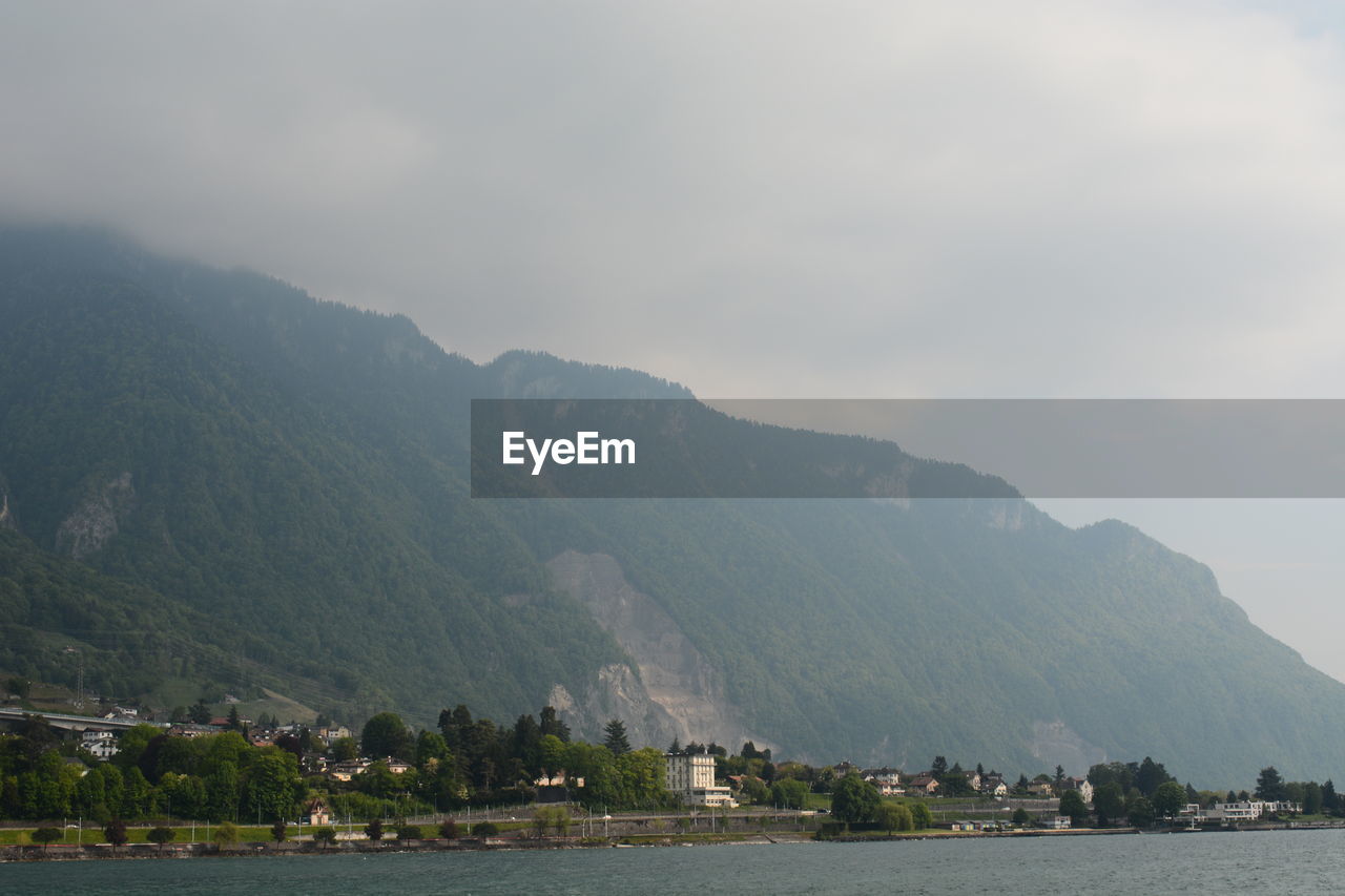 Scenic view of bay against mountains