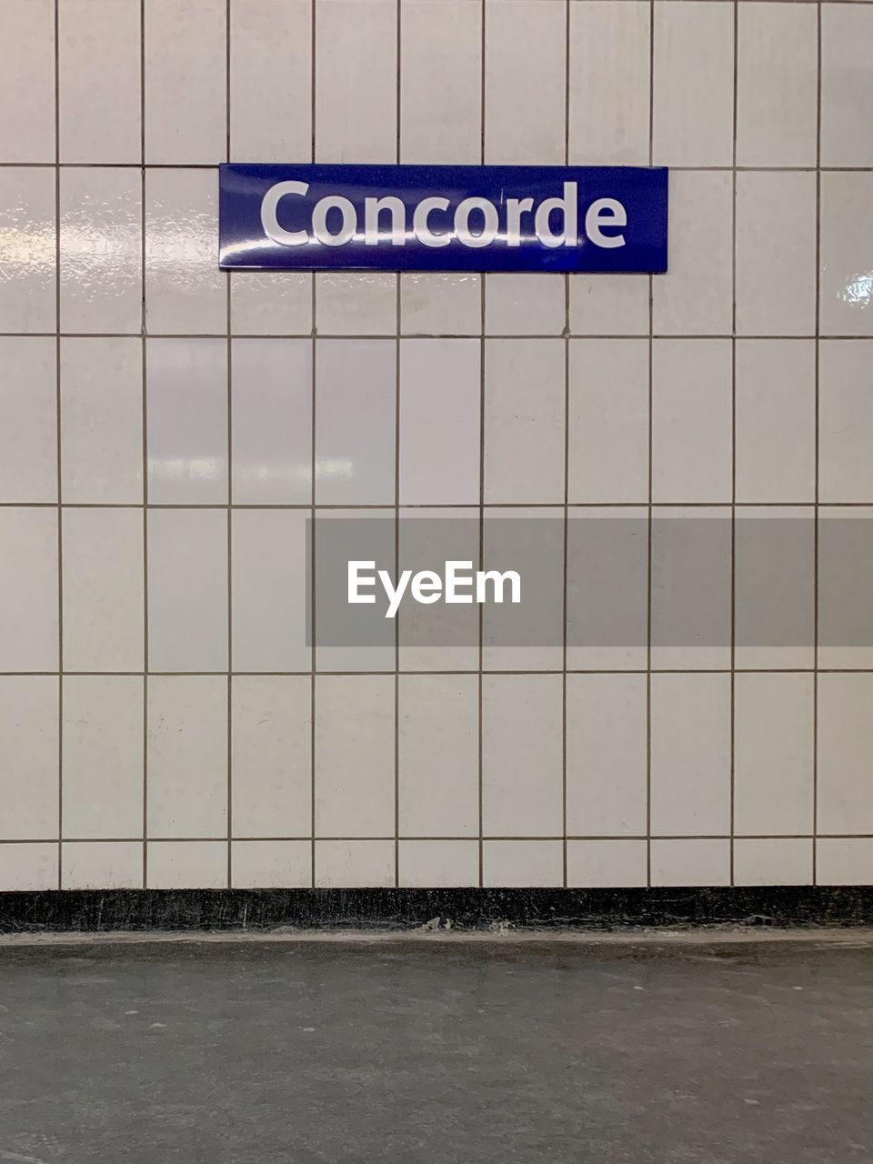 Text on wall at subway station