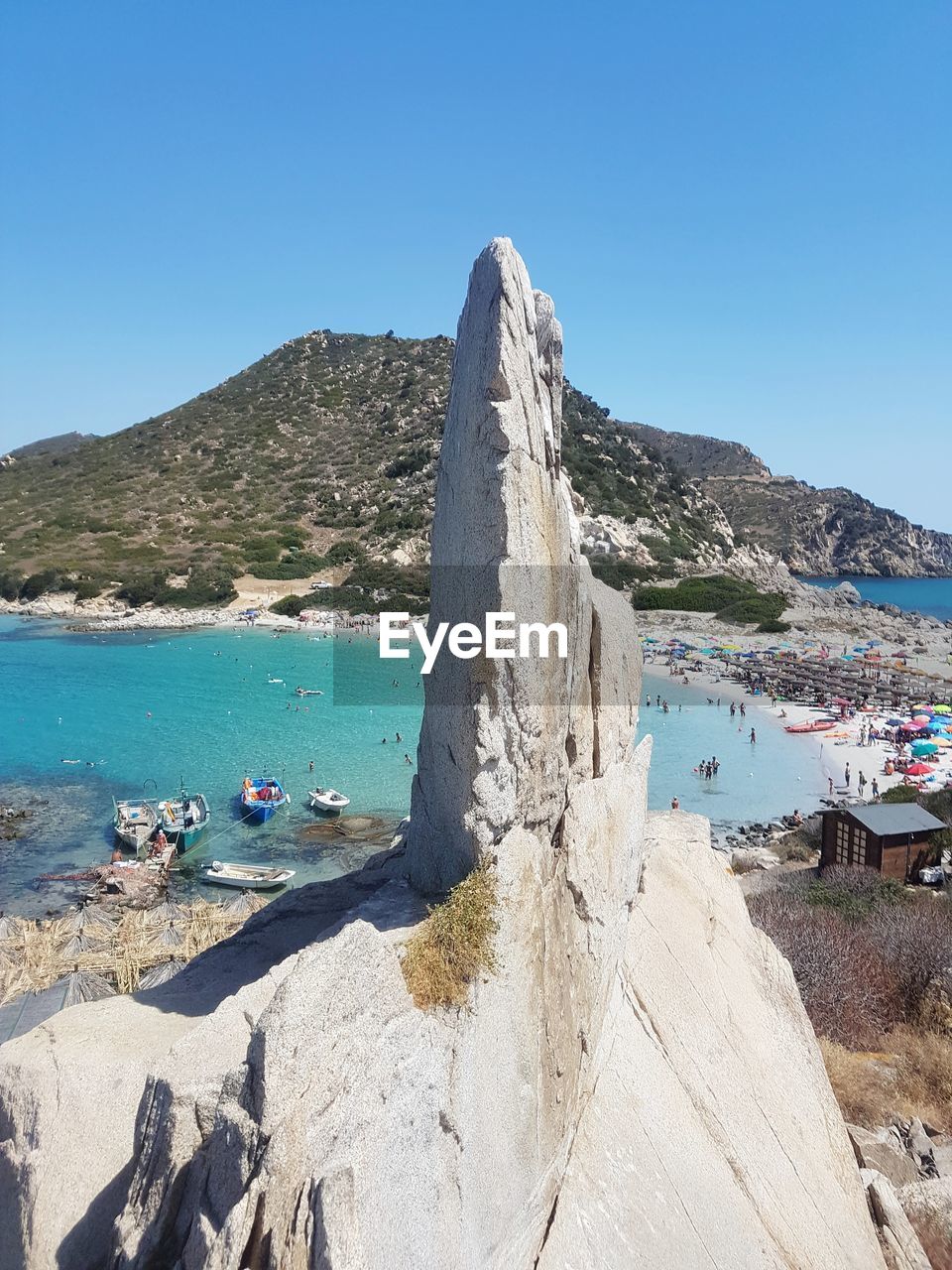 SCENIC VIEW OF BEACH AGAINST CLEAR BLUE SKY