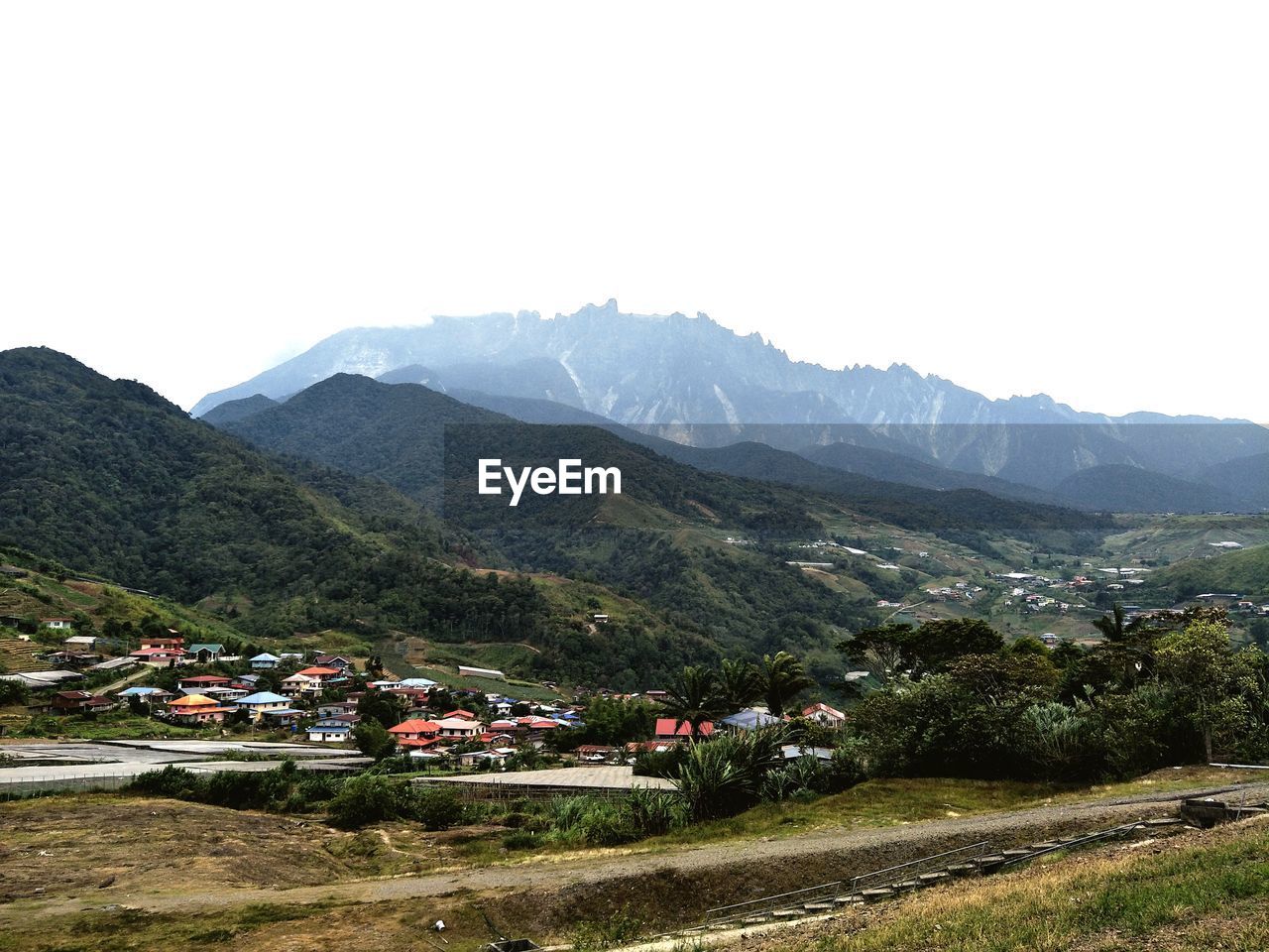 SCENIC VIEW OF LANDSCAPE AND MOUNTAINS AGAINST SKY