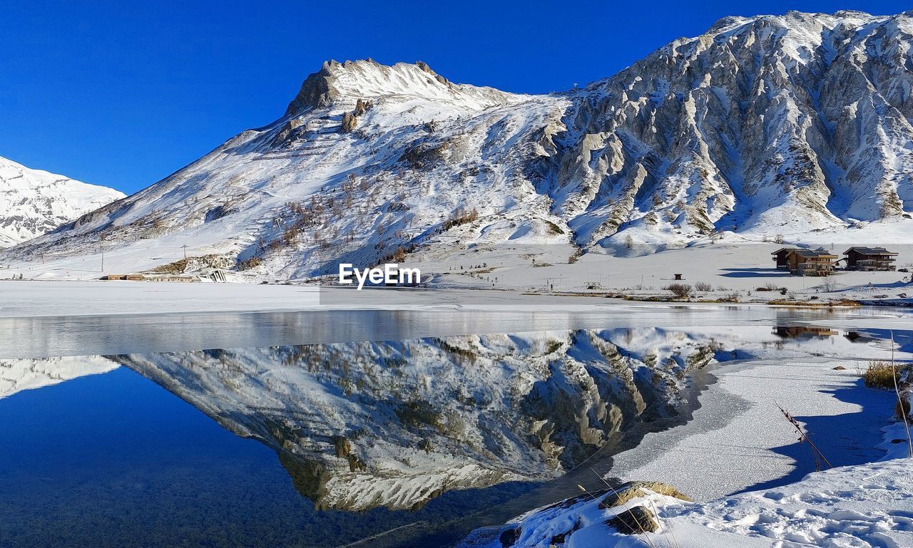 Scenic view of snowcapped mountains against sky