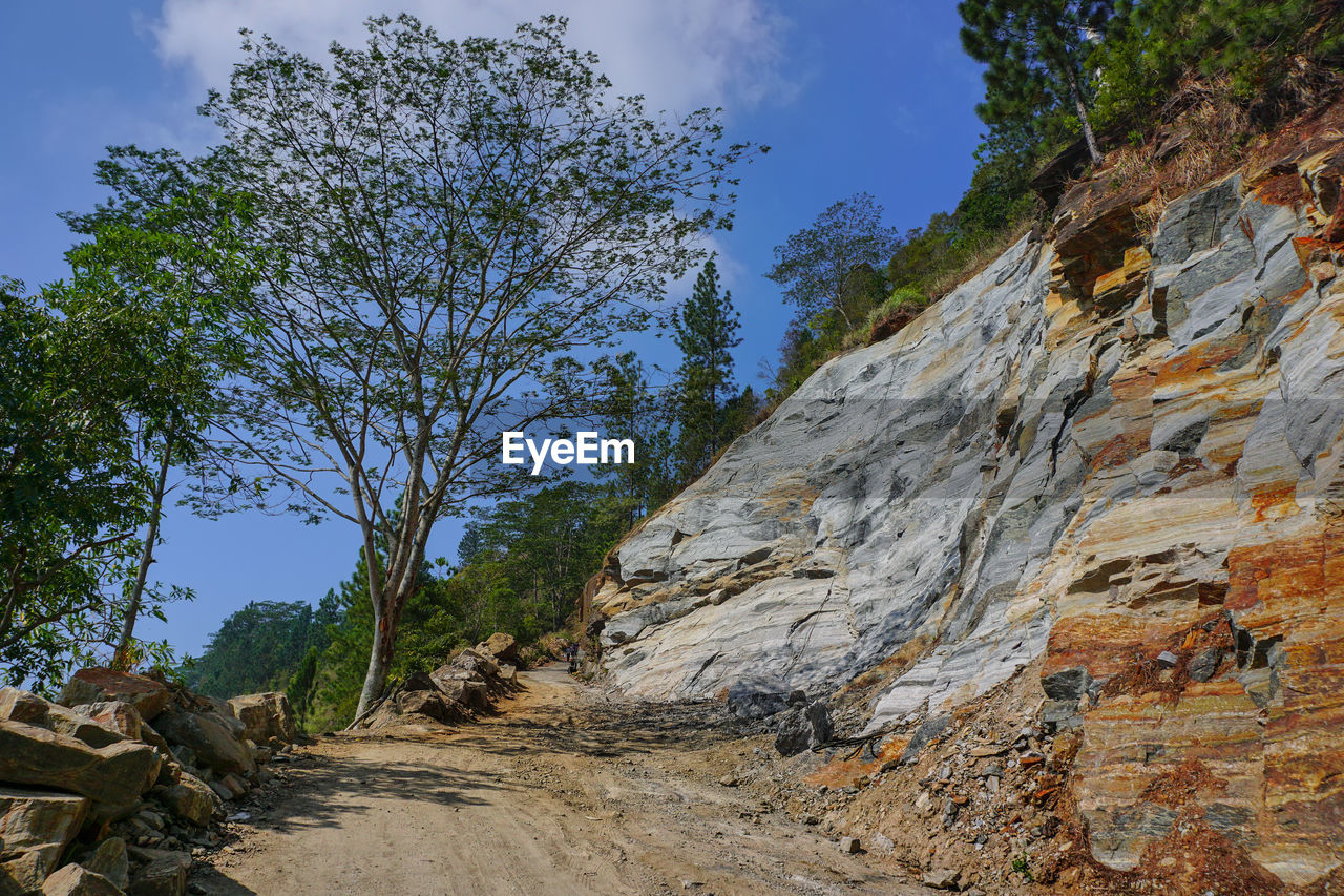 LOW ANGLE VIEW OF ROCK FORMATION AGAINST SKY
