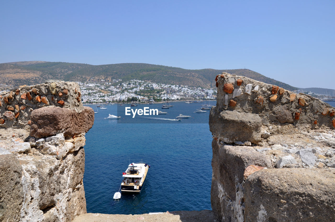 Scenic view of sea against clear blue sky