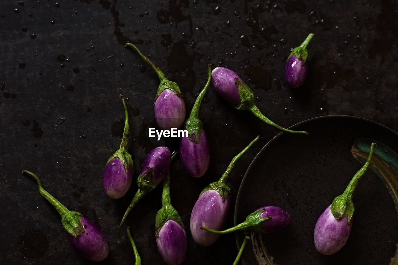 High angle view of eggplants in plate on table