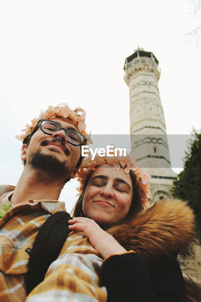 Self portrait of young tourist couple in front of historic mosque adana turkey
