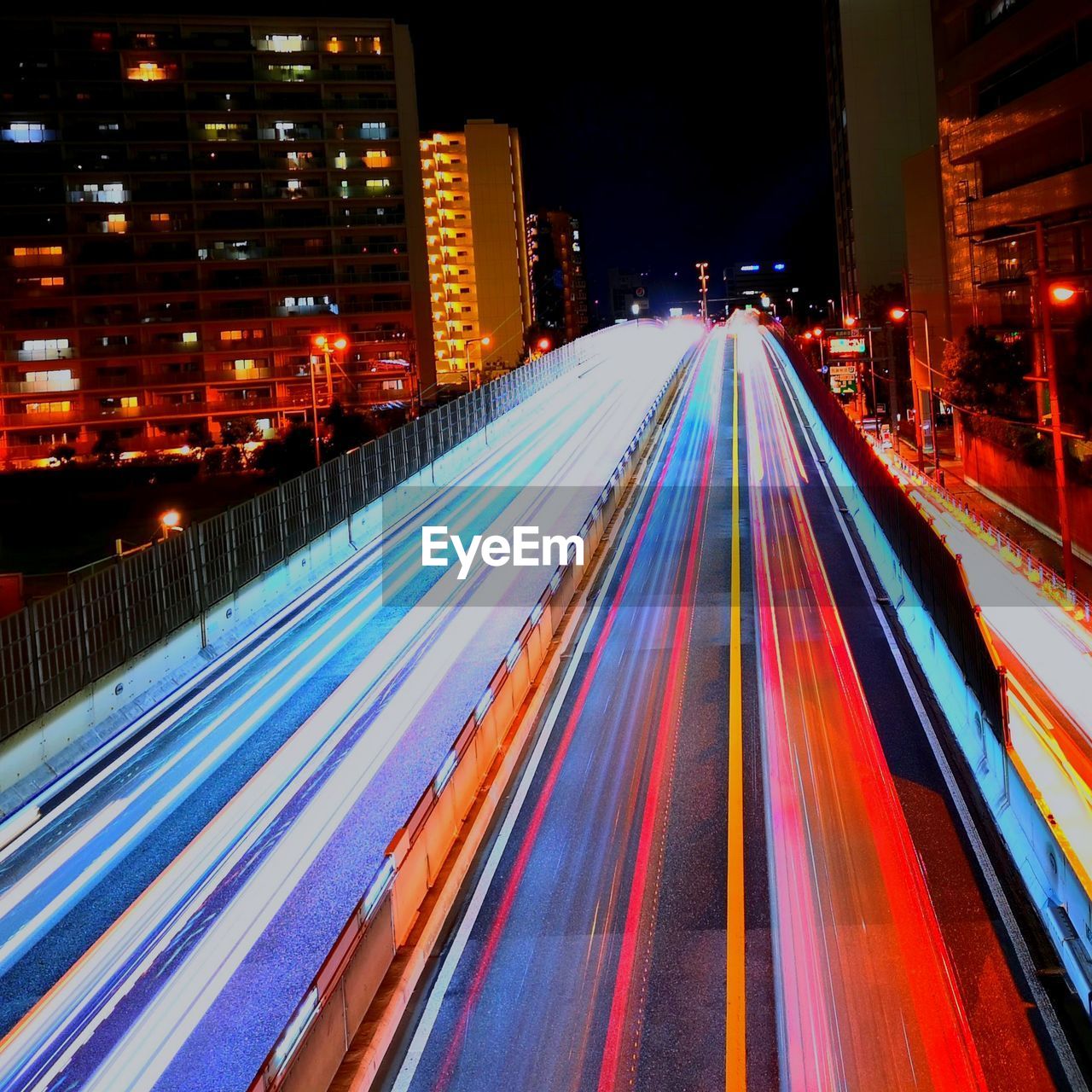 High angle view of light trails on road at night