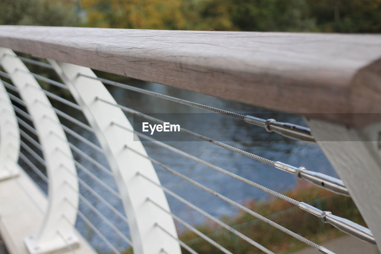 CLOSE-UP OF ROPES ON RAILING