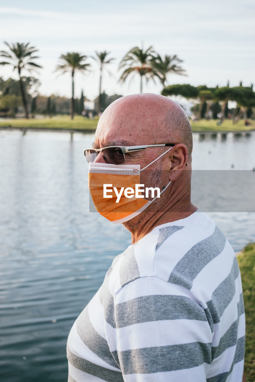 Portrait of man standing on water