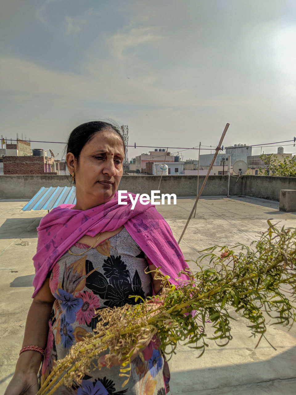 Portrait of woman against sky