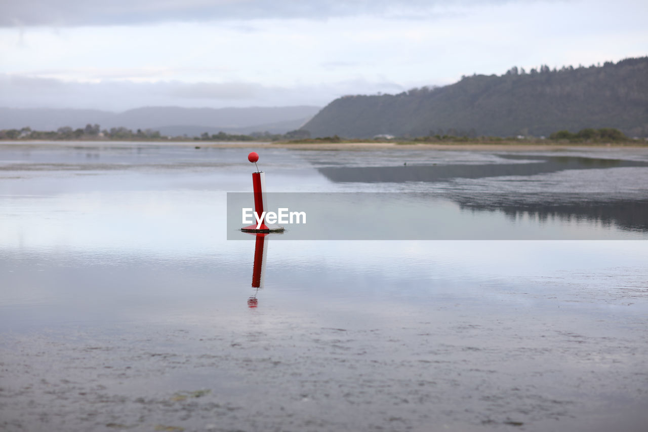 Floating buoy -  anchored in water to warn of danger.