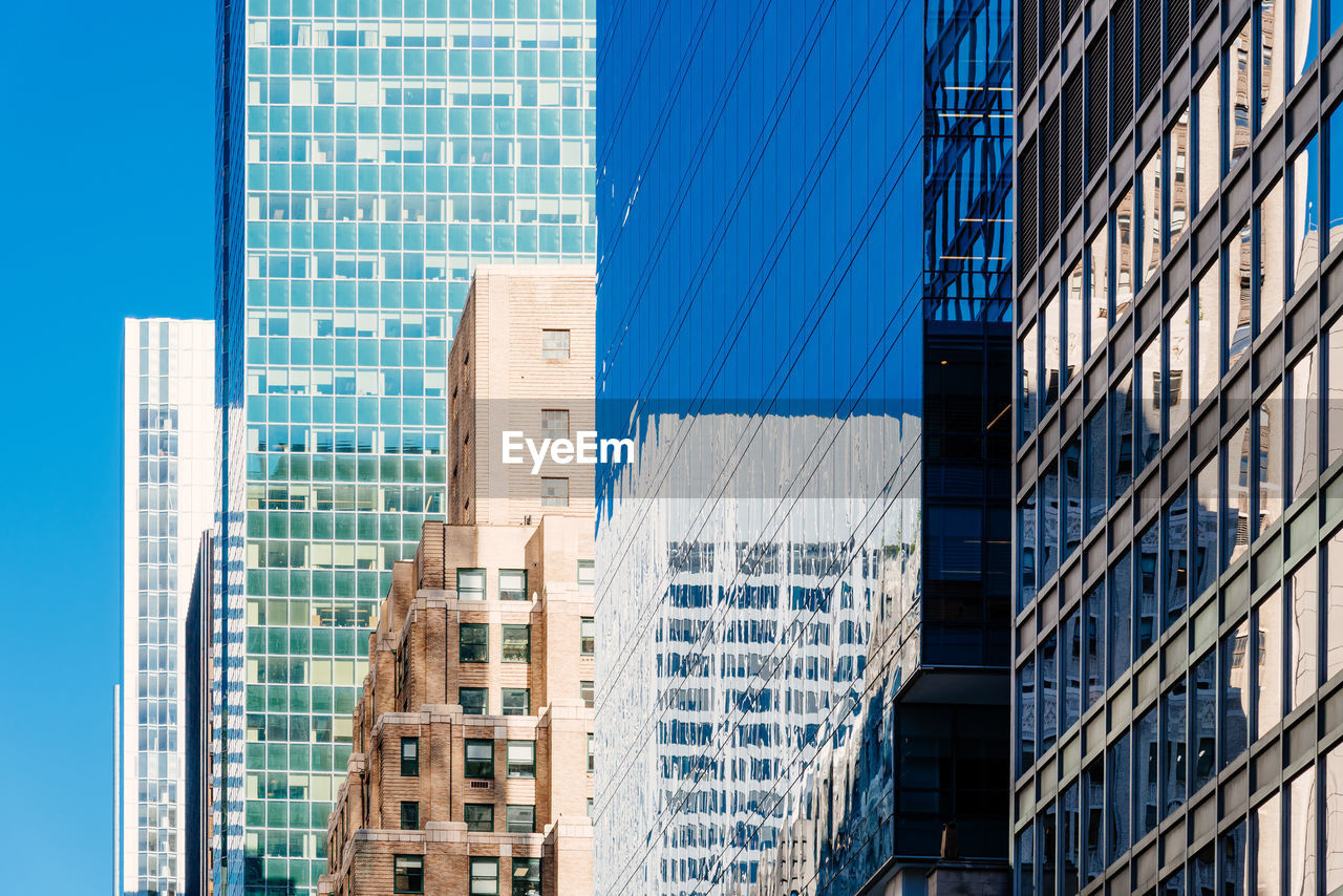 Low angle view of modern buildings in city