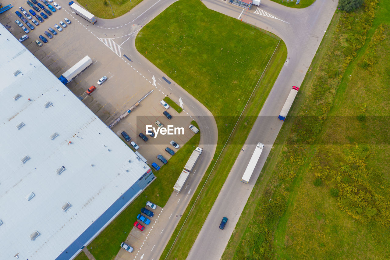 Aerial view of the distribution center, drone photography of the industrial logistic zone. trucks on