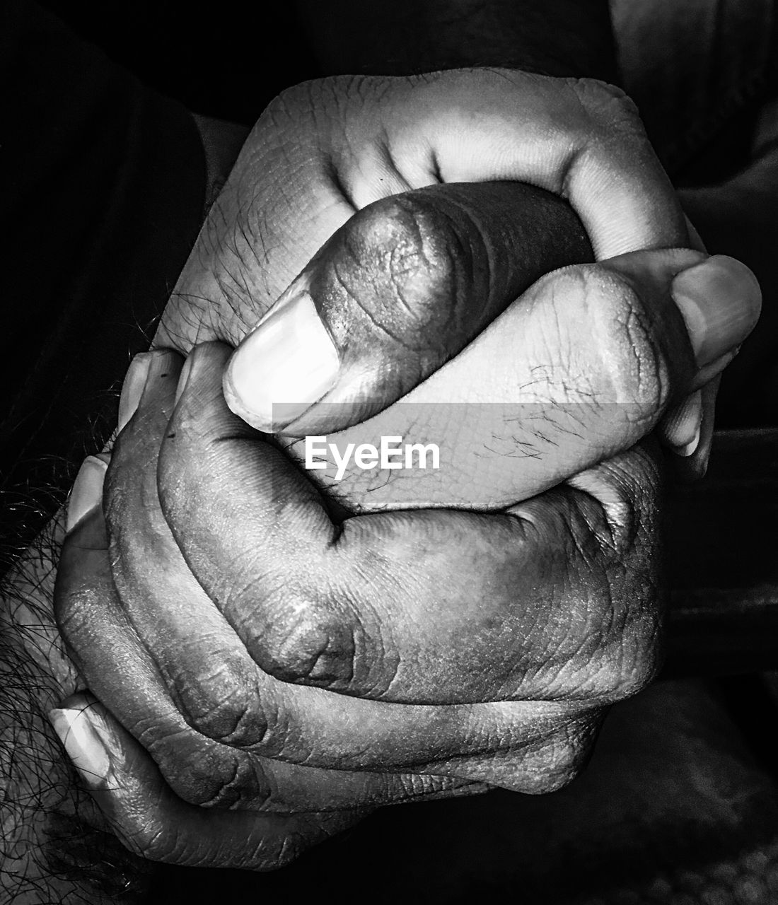 Close-up of man holding hands