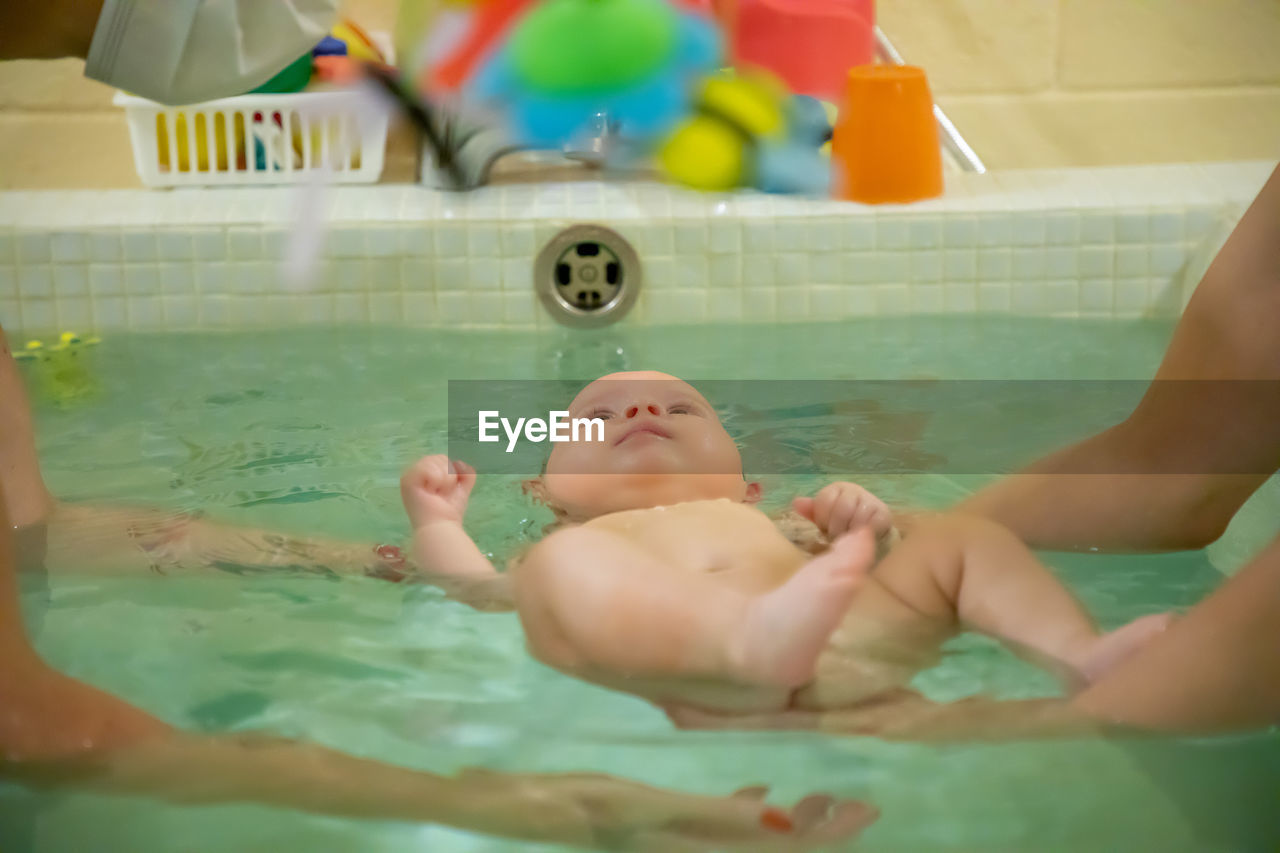 High angle view of baby boy in swimming pool