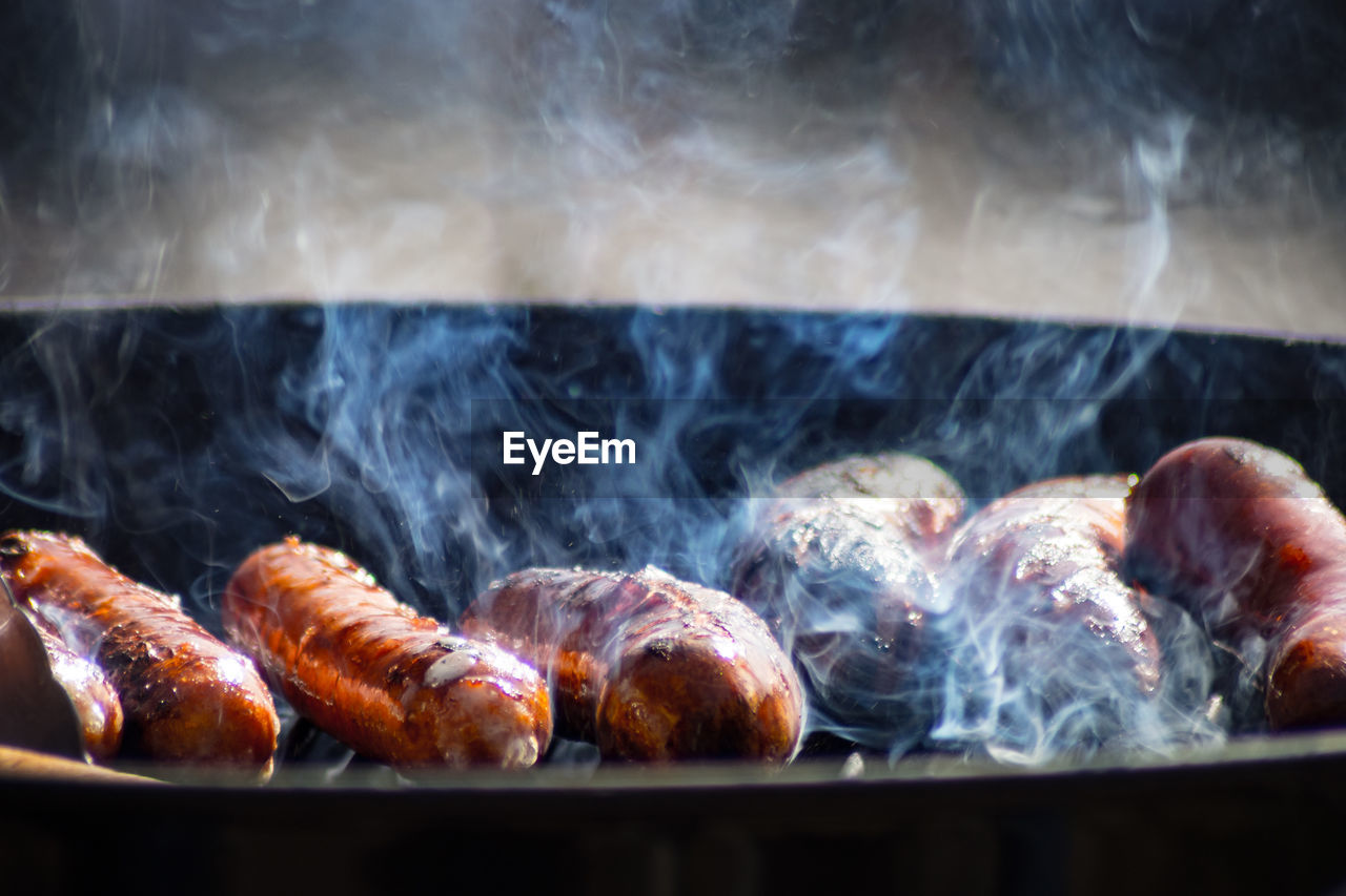 Close-up of meat cooking on barbecue grill