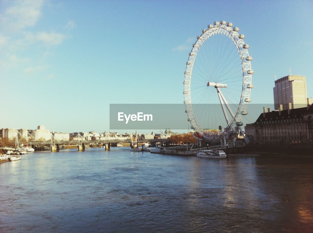 View of london eye against blue sky