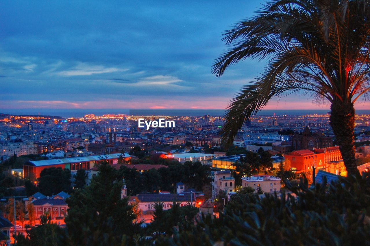 Illuminated cityscape against sky at night