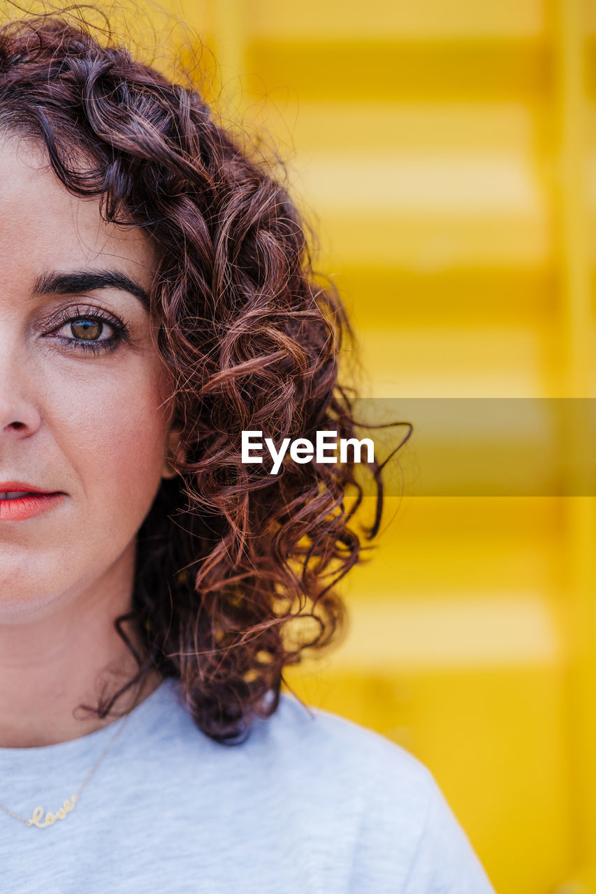 PORTRAIT OF BEAUTIFUL WOMAN WITH YELLOW EYES