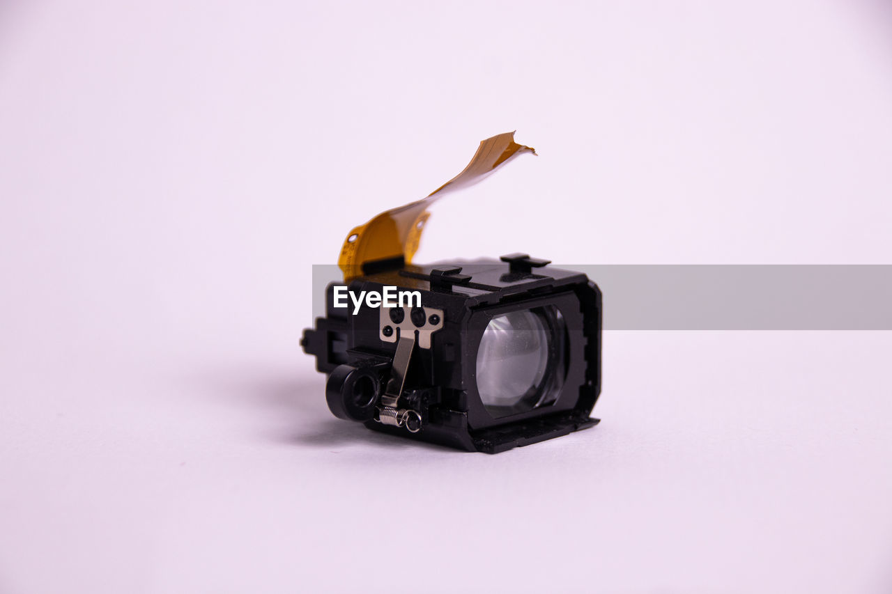 Close up of a camera viewfinder in front of a white background 