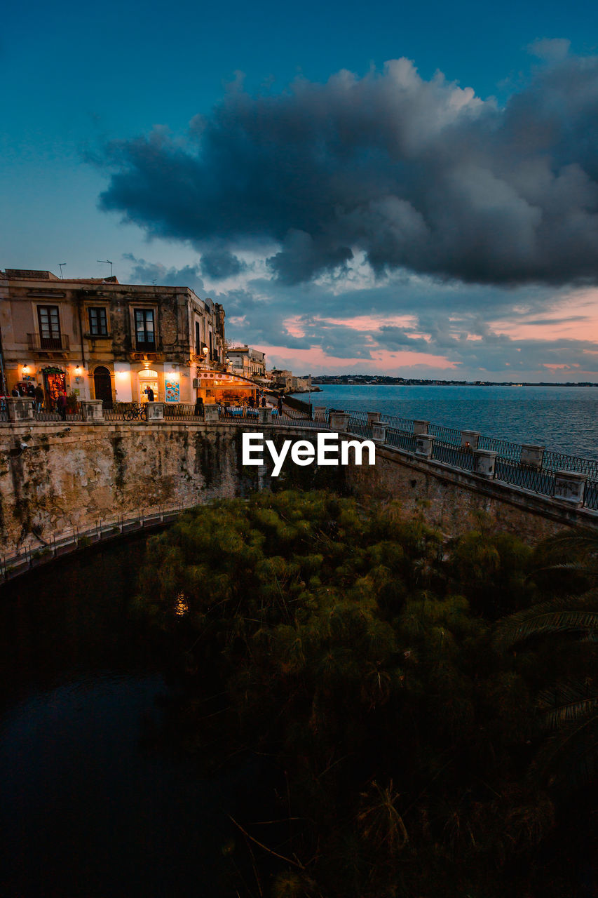 Panoramic view of ortigia with fonte aretusa and lungomare alfeo  during sunset