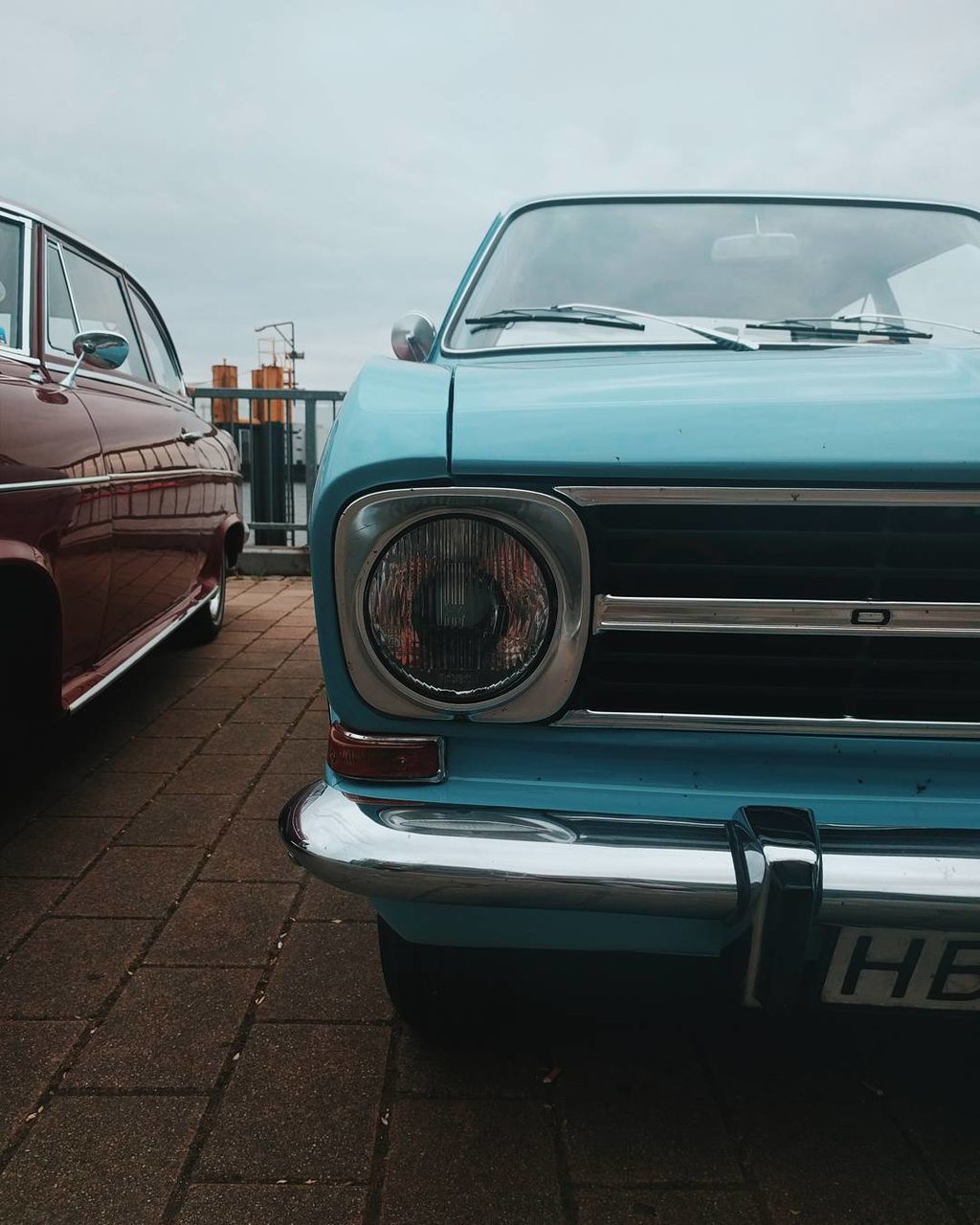 Vintage car in city against sky