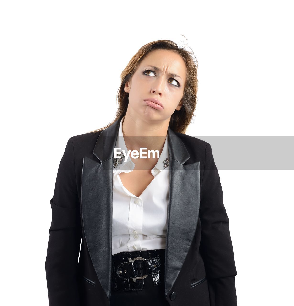 PORTRAIT OF YOUNG WOMAN AGAINST WHITE BACKGROUND