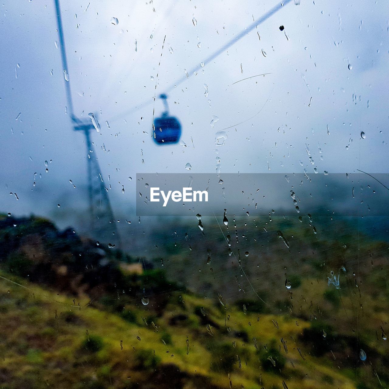 RAIN DROPS ON GLASS WINDOW OF RAINY SEASON