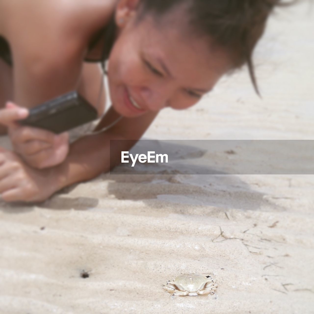 Woman playing with ball in background