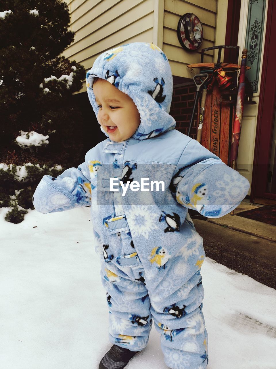 Cute boy standing in snow