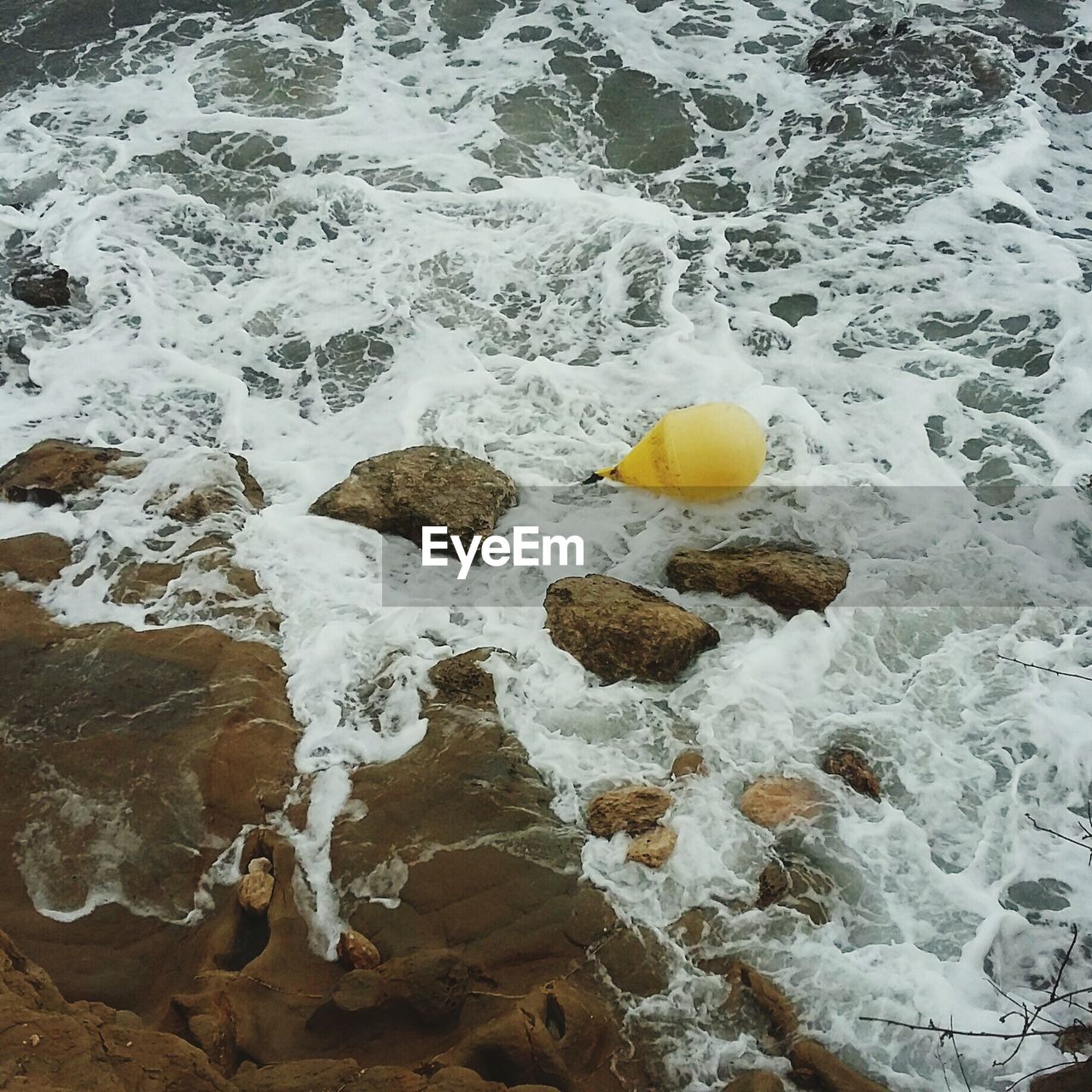 CLOSE-UP OF WATER SPLASHING ON SHORE