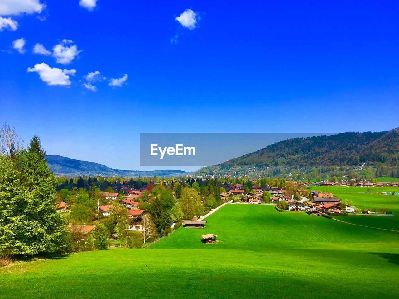 Scenic view of landscape against blue sky