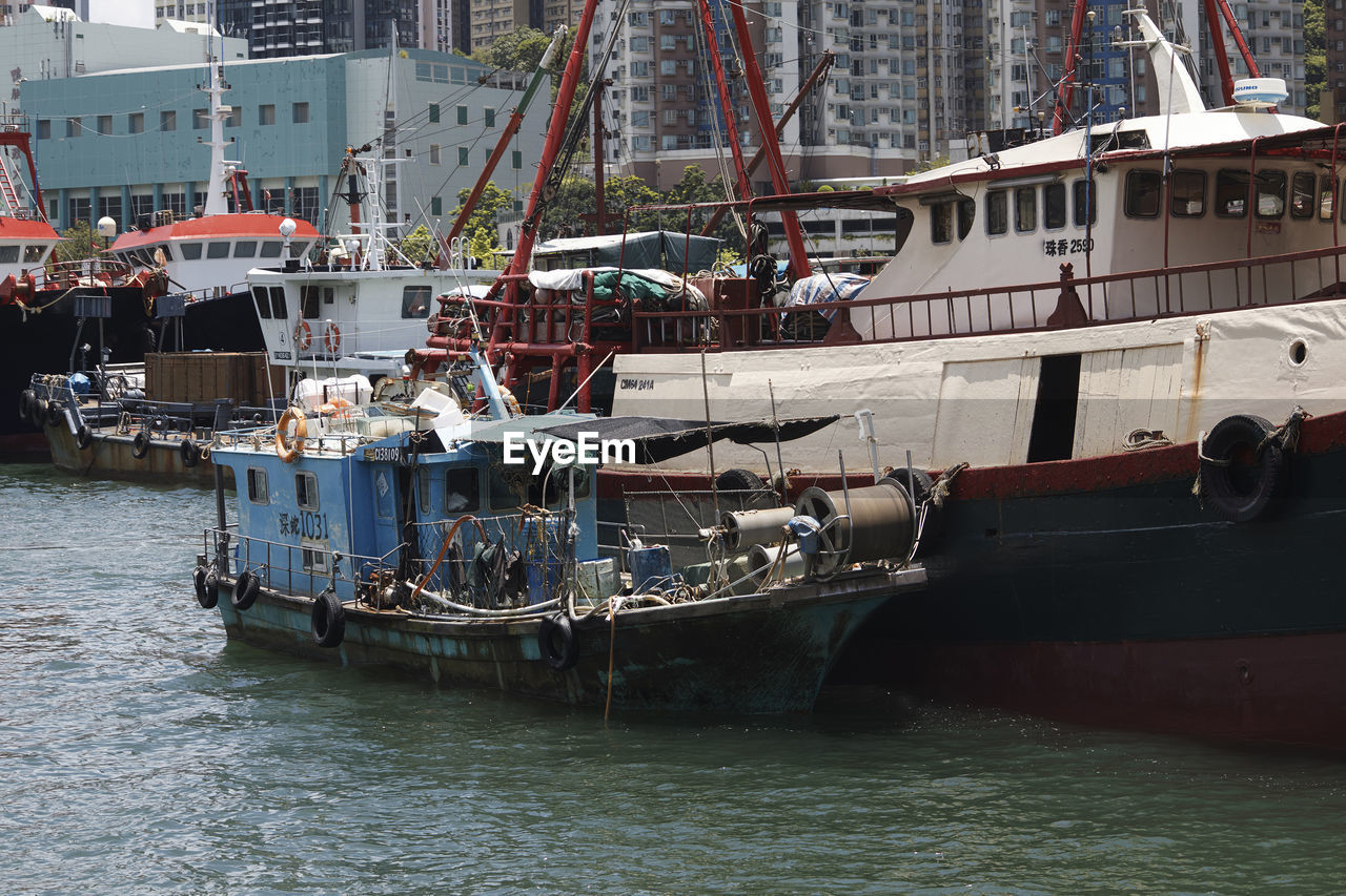 BOATS MOORED IN HARBOR