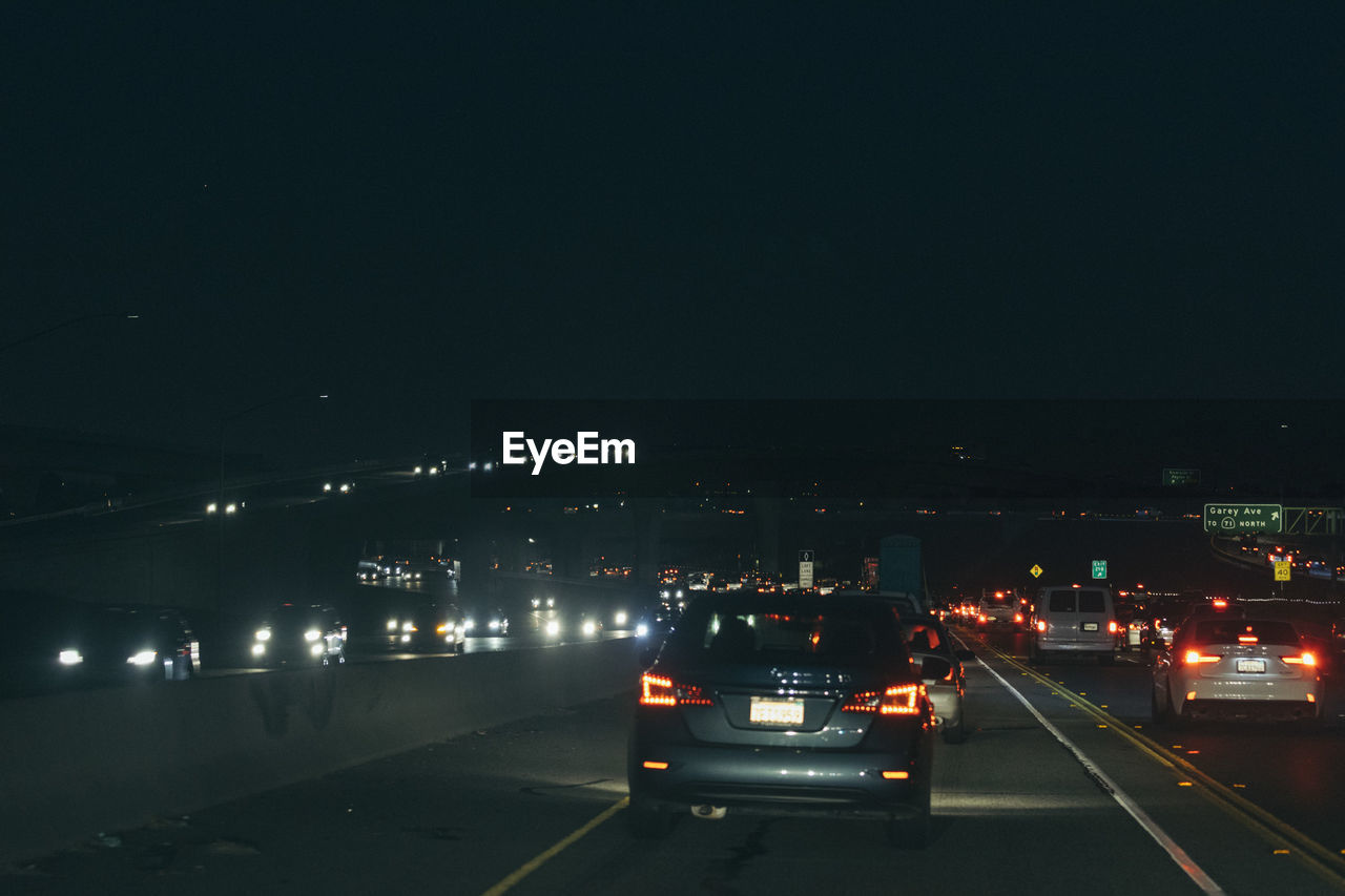 CARS ON ROAD AT NIGHT