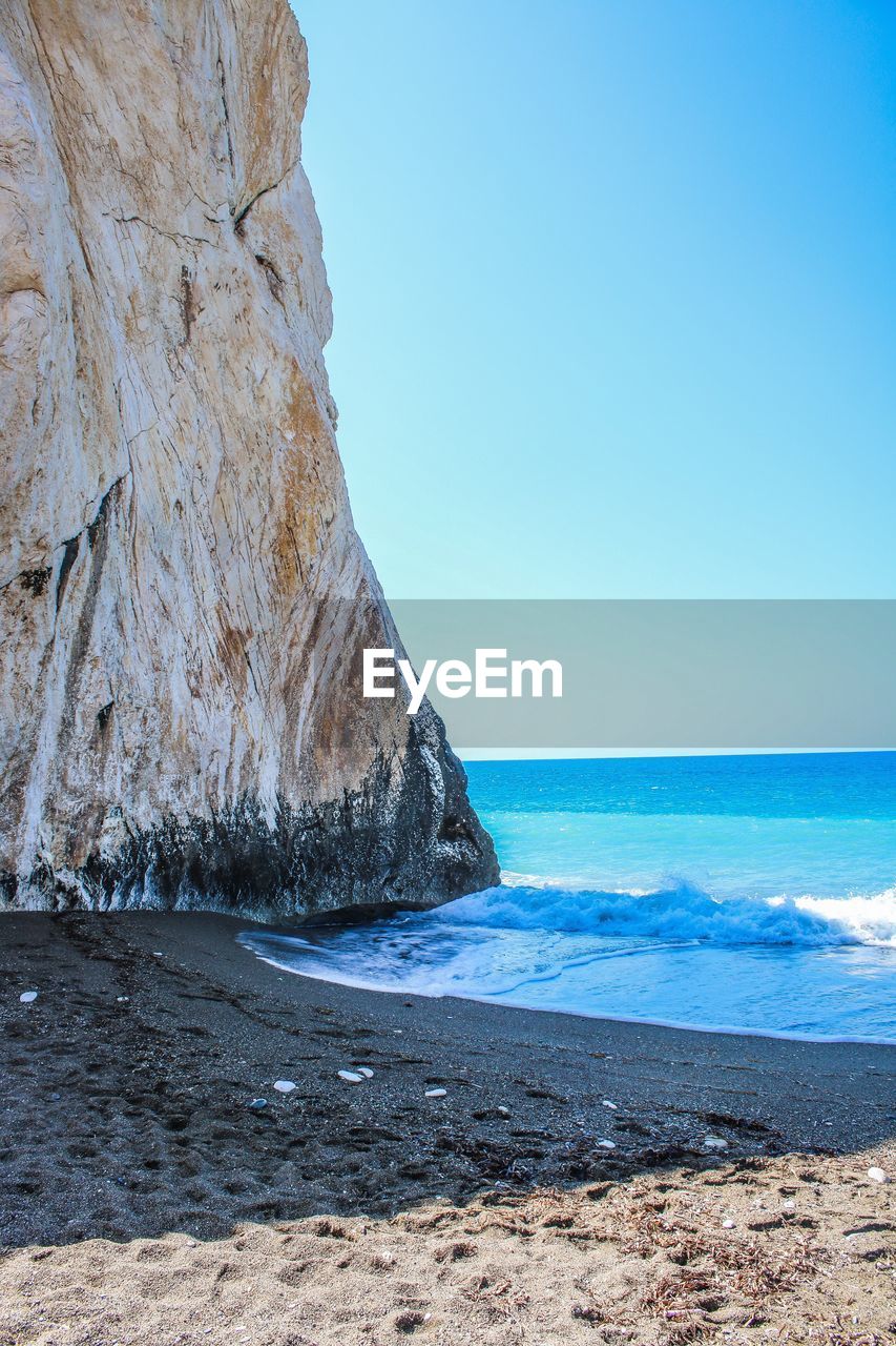 Scenic view of sea against clear blue sky