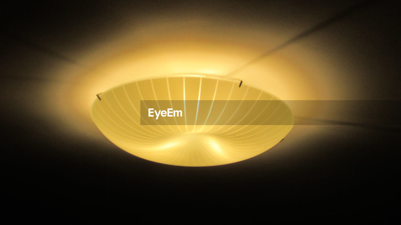 LOW ANGLE VIEW OF ILLUMINATED LIGHT BULB