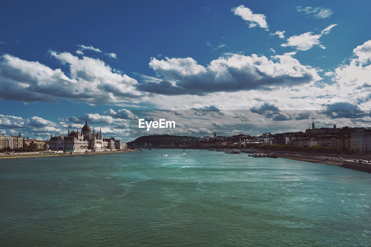 Danube river against sky in city