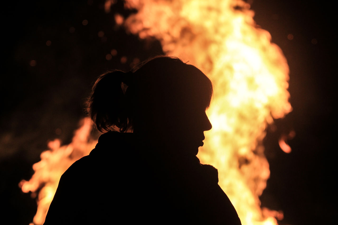 PORTRAIT OF SILHOUETTE MAN AGAINST ORANGE FIRE