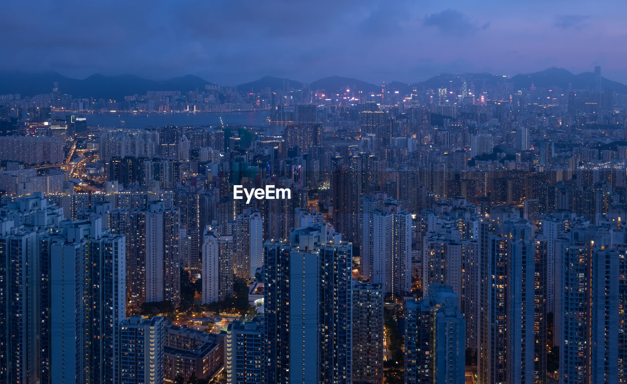 Cityscape with cloud sky in hong kong. blue hour.
