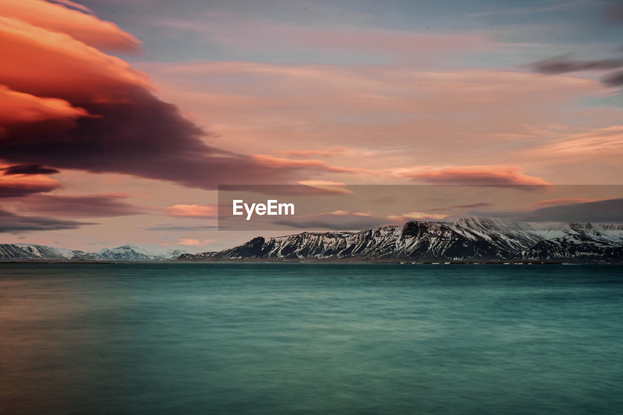 Scenic view of sea against dramatic sky