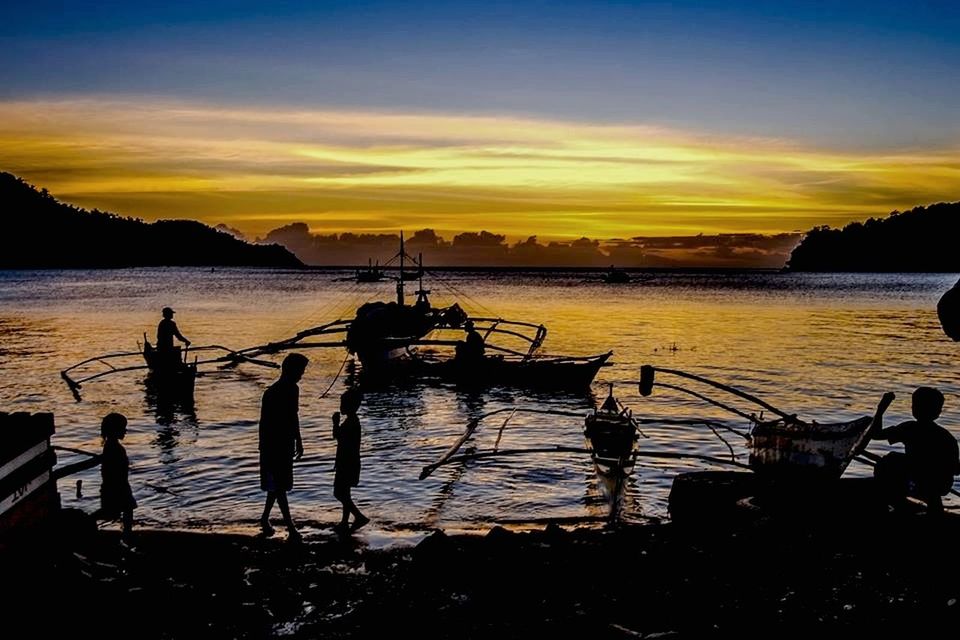 SCENIC VIEW OF SUNSET OVER SEA