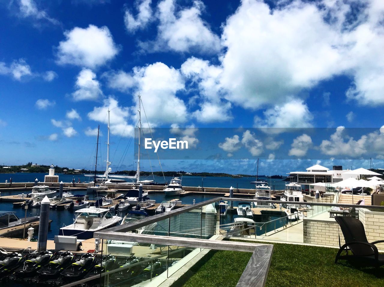 HIGH ANGLE VIEW OF HARBOR AGAINST SKY