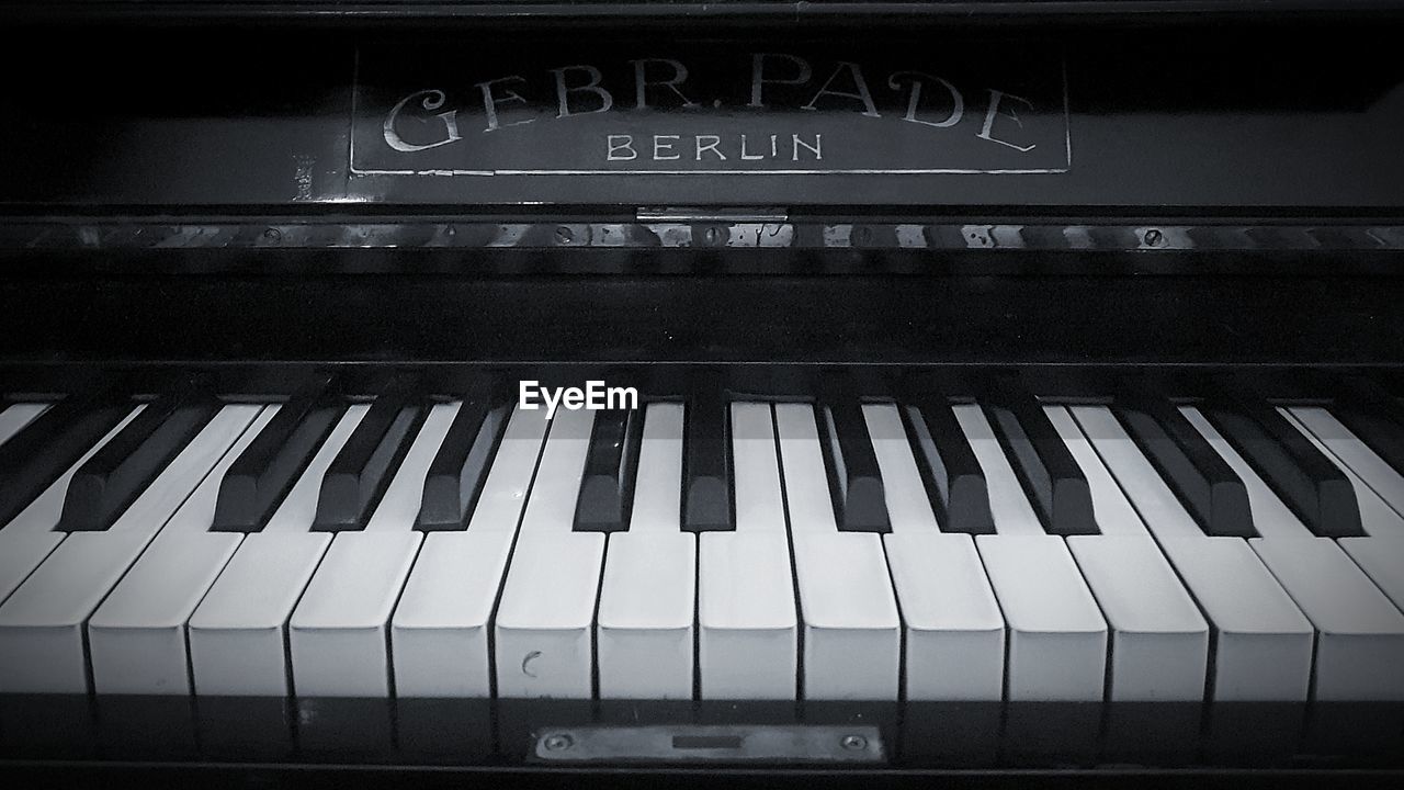 CLOSE-UP OF PIANO KEYS AT NIGHT