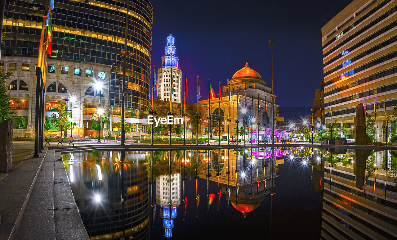 VIEW OF ILLUMINATED CITY AT NIGHT