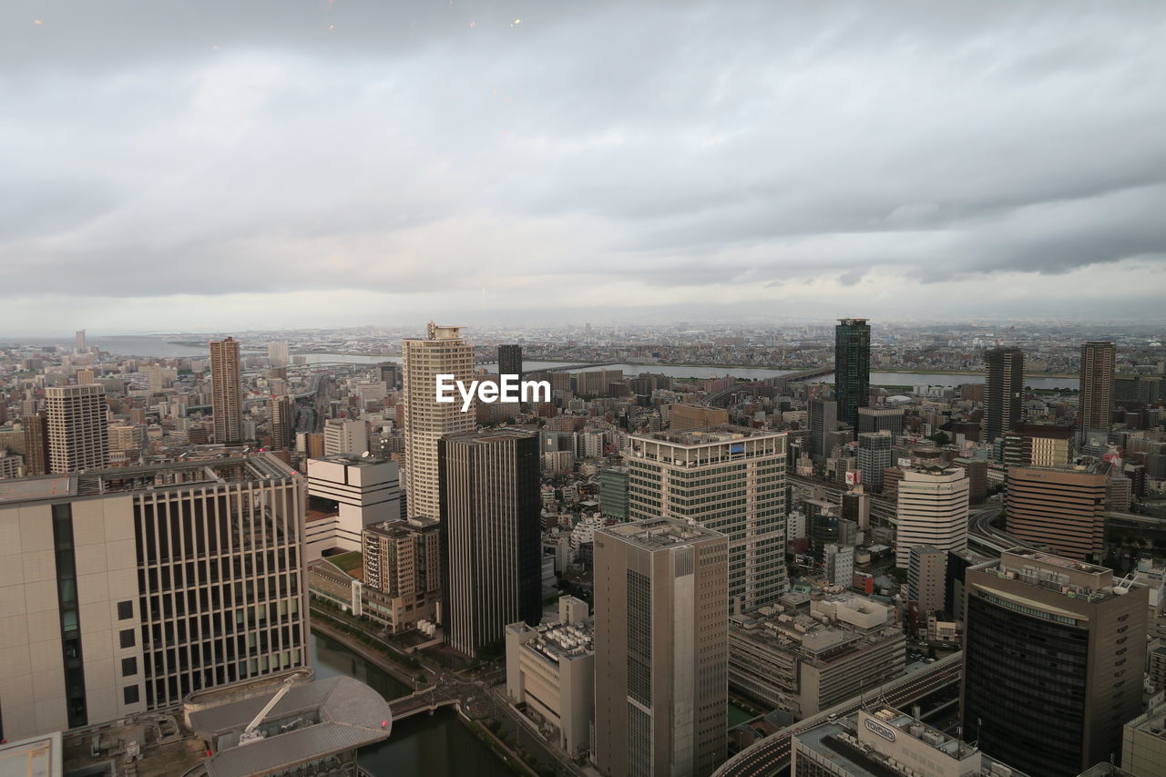 High angle view of buildings in city against sky