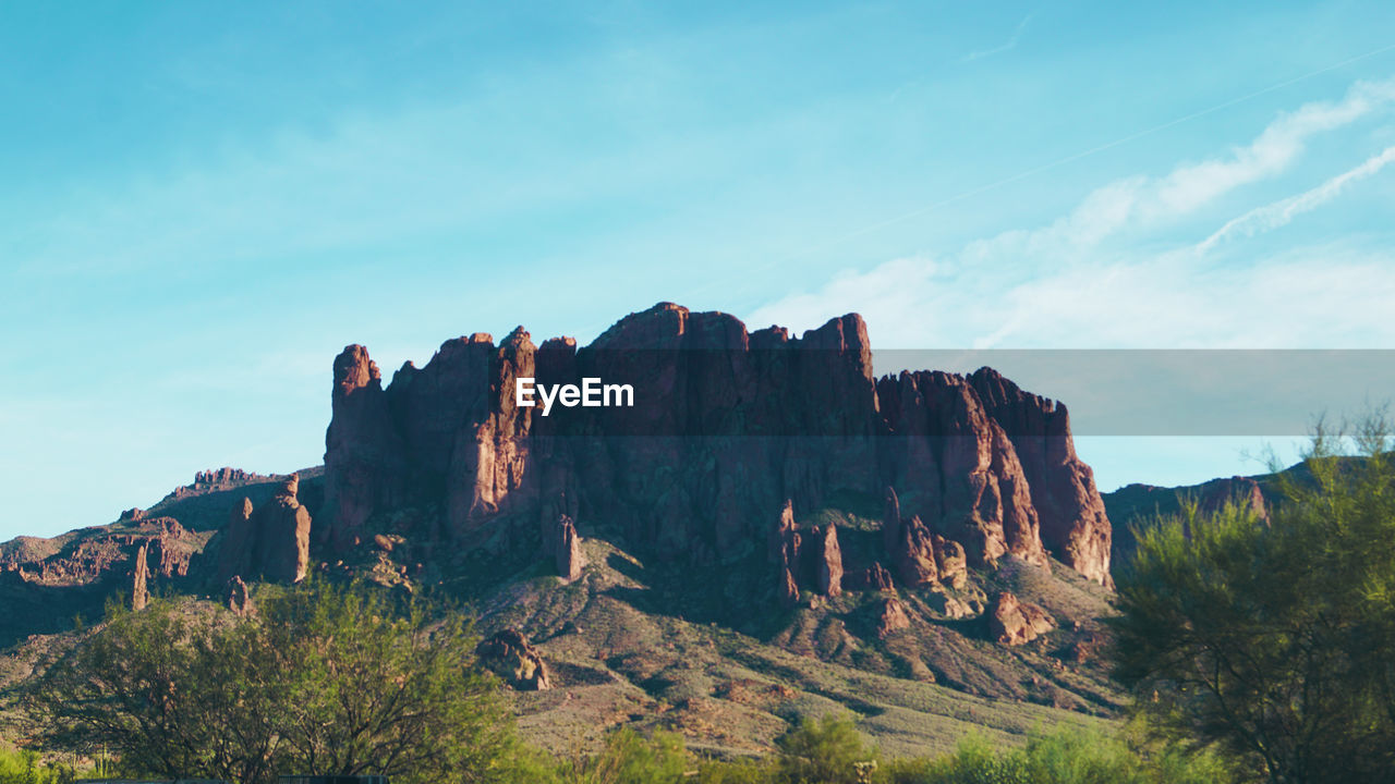 PANORAMIC VIEW OF ROCKS AGAINST SKY